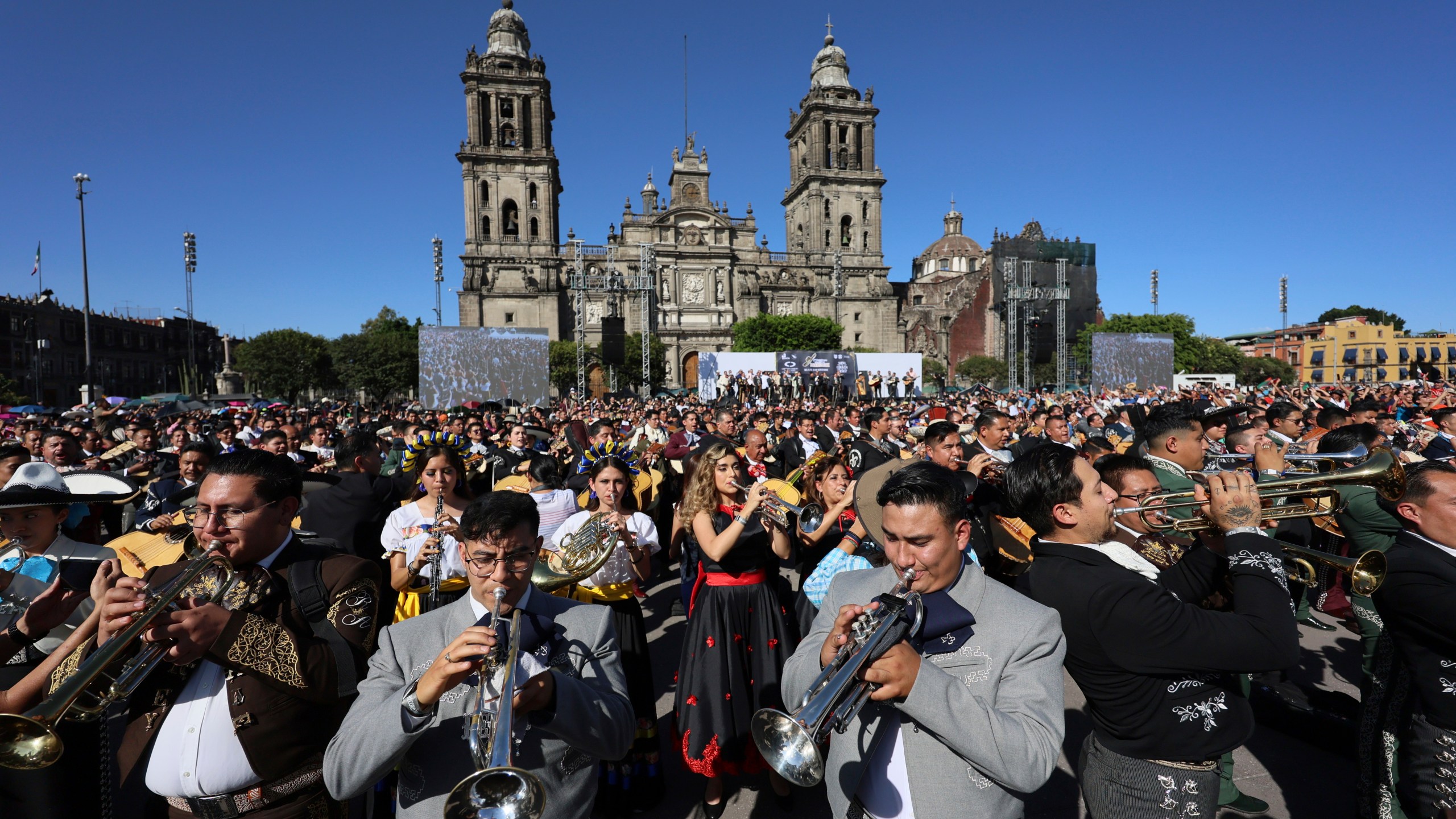 Musicians gather to break the record of most mariachis performing in unison, at the Zocalo, Mexico City's main square, Sunday, Nov. 10, 2024. (AP Photo/Ginnette Riquelme)