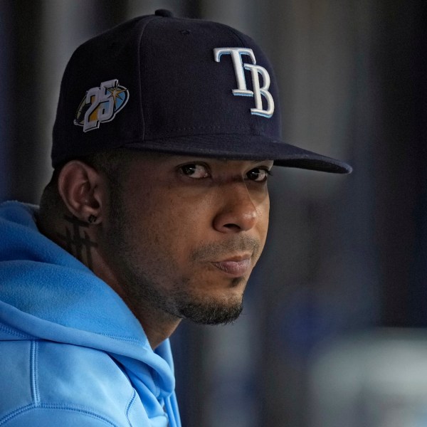 FILE - Tampa Bay Rays shortstop Wander Franco watches from the dugout during the fifth inning of a baseball game against the Cleveland Guardians, Aug. 13, 2023, in St. Petersburg, Fla. (AP Photo/Chris O'Meara, File)