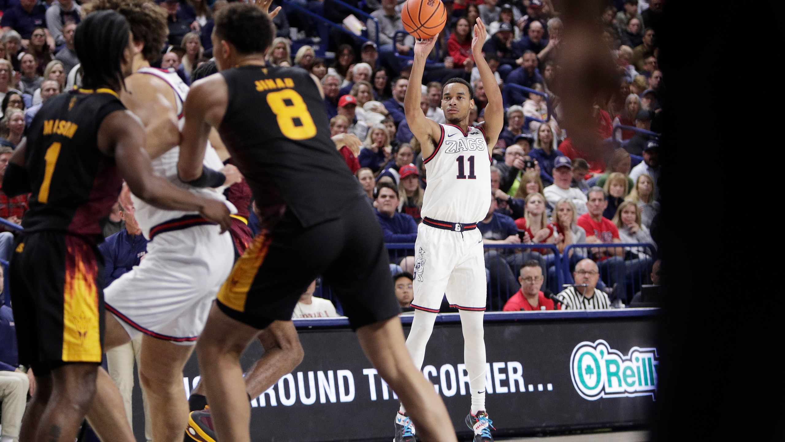 Gonzaga guard Nolan Hickman (11) looks to shoot during the second half of an NCAA college basketball game against Arizona State, Sunday, Nov. 10, 2024, in Spokane, Wash. (AP Photo/Young Kwak)