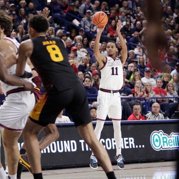 Gonzaga guard Nolan Hickman (11) looks to shoot during the second half of an NCAA college basketball game against Arizona State, Sunday, Nov. 10, 2024, in Spokane, Wash. (AP Photo/Young Kwak)