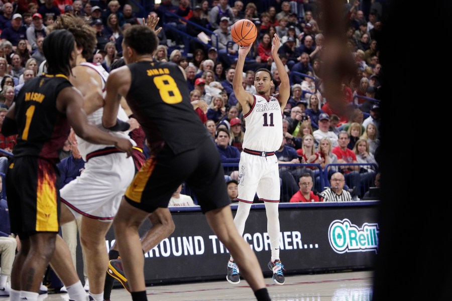 Gonzaga guard Nolan Hickman (11) looks to shoot during the second half of an NCAA college basketball game against Arizona State, Sunday, Nov. 10, 2024, in Spokane, Wash. (AP Photo/Young Kwak)