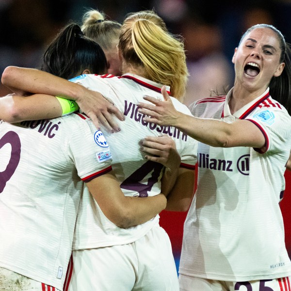 FILE - Front from left, Munich's Jovana Damnjanovic, scorer Glodis Perla Viggosdottir, and Sarah Zadrazil celebrate ther side's first goal during the women's Champions League group C soccer match between FC Bayern Munich and Arsenal Women FC in Munich, Germany, Wednesday, Oct. 9, 2024. (Sven Hoppe/dpa via AP, File)