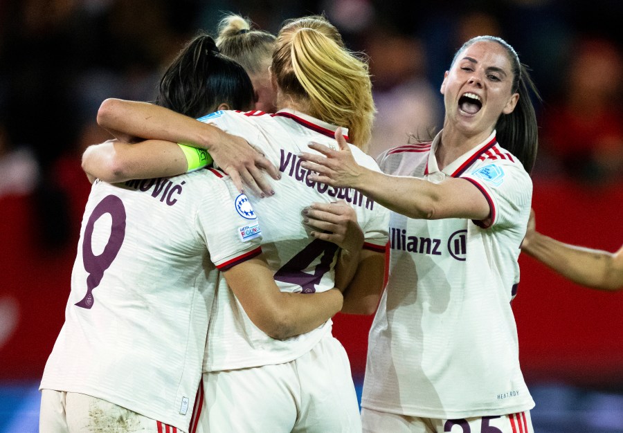 FILE - Front from left, Munich's Jovana Damnjanovic, scorer Glodis Perla Viggosdottir, and Sarah Zadrazil celebrate ther side's first goal during the women's Champions League group C soccer match between FC Bayern Munich and Arsenal Women FC in Munich, Germany, Wednesday, Oct. 9, 2024. (Sven Hoppe/dpa via AP, File)