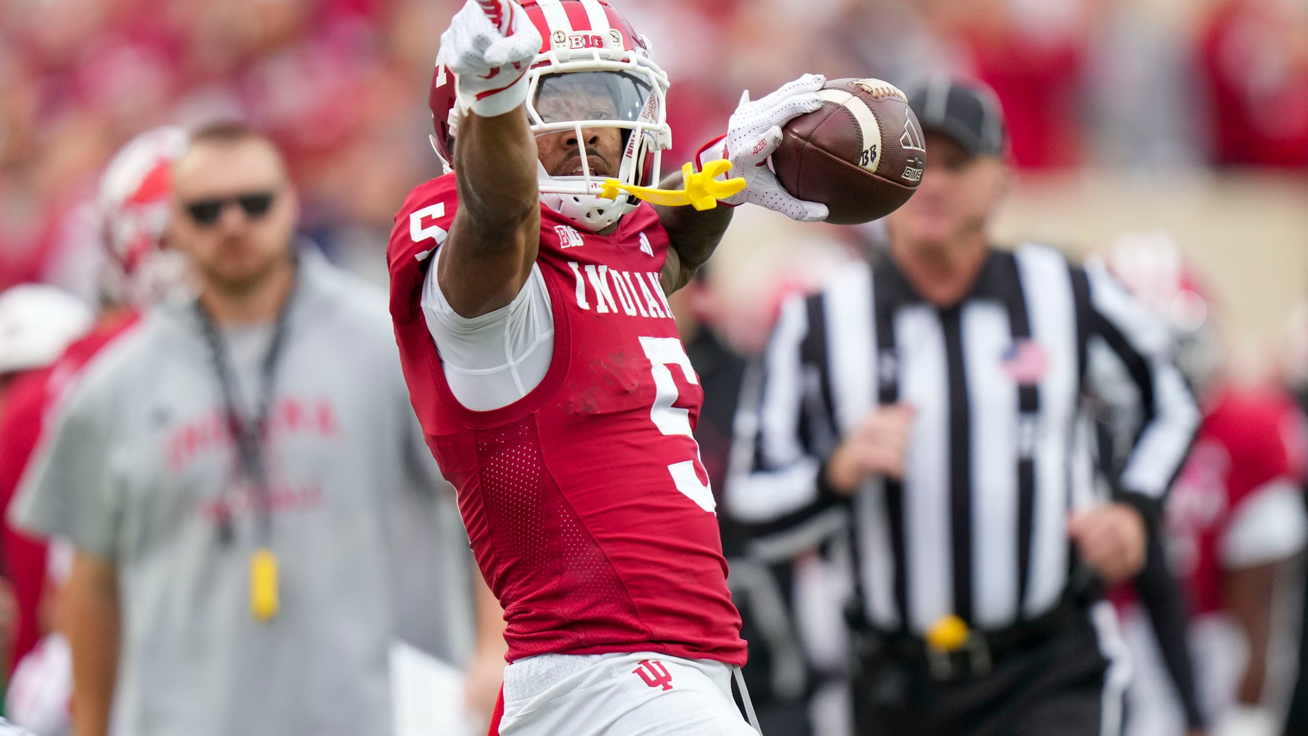 Indiana wide receiver Ke'Shawn Williams (5) reacts after completing a catch against Michigan during the first half of an NCAA college football game in Bloomington, Ind., Saturday, Nov. 9, 2024. (AP Photo/AJ Mast)