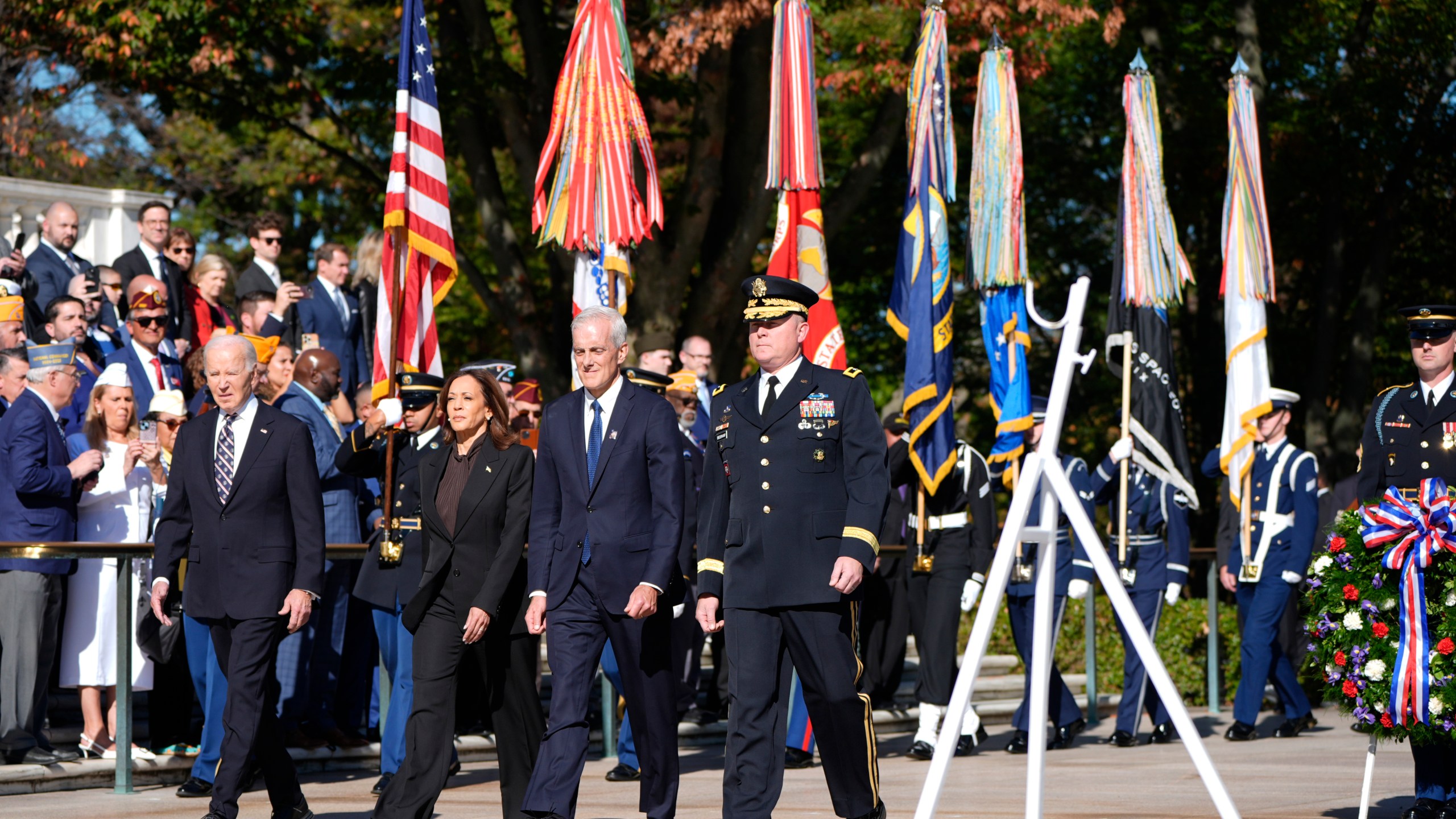 President Joe Biden, from left, Vice President Kamala Harris, Veterans Affairs Secretary Denis McDonough and Maj. Gen. Trevor Bredenkamp, commanding general of the Joint Task Force-National Capital Region and the U.S. Military District of Washington, arrive at a wreath laying ceremony at the Tomb of the Unknown Soldier on National Veterans Day Observance at Arlington National Cemetery in Arlington, Va., Monday, Nov. 11, 2024. (AP Photo/Mark Schiefelbein)