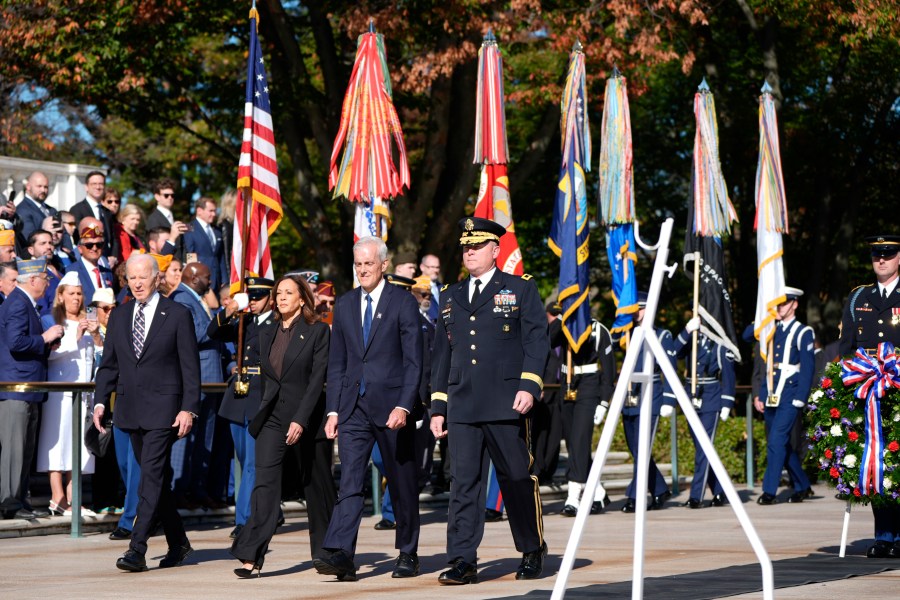 President Joe Biden, from left, Vice President Kamala Harris, Veterans Affairs Secretary Denis McDonough and Maj. Gen. Trevor Bredenkamp, commanding general of the Joint Task Force-National Capital Region and the U.S. Military District of Washington, arrive at a wreath laying ceremony at the Tomb of the Unknown Soldier on National Veterans Day Observance at Arlington National Cemetery in Arlington, Va., Monday, Nov. 11, 2024. (AP Photo/Mark Schiefelbein)