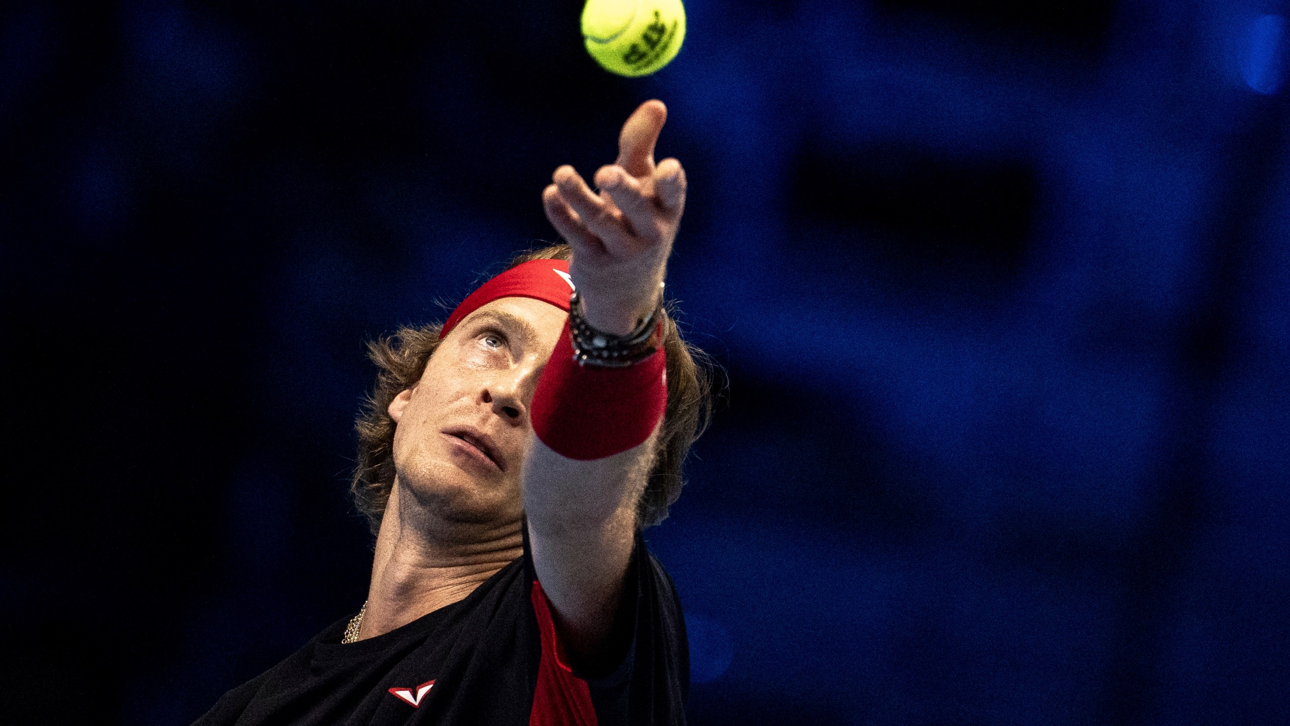 Russia's Andrey Rublev serves to Germany's Alexander Zverev at the ATP Finals tennis tournament in Turin, Italy, Monday, Nov. 11, 2024. (Marco Alpozzi/LaPresse via AP)