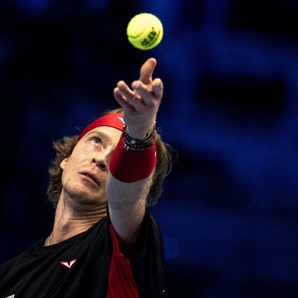 Russia's Andrey Rublev serves to Germany's Alexander Zverev at the ATP Finals tennis tournament in Turin, Italy, Monday, Nov. 11, 2024. (Marco Alpozzi/LaPresse via AP)