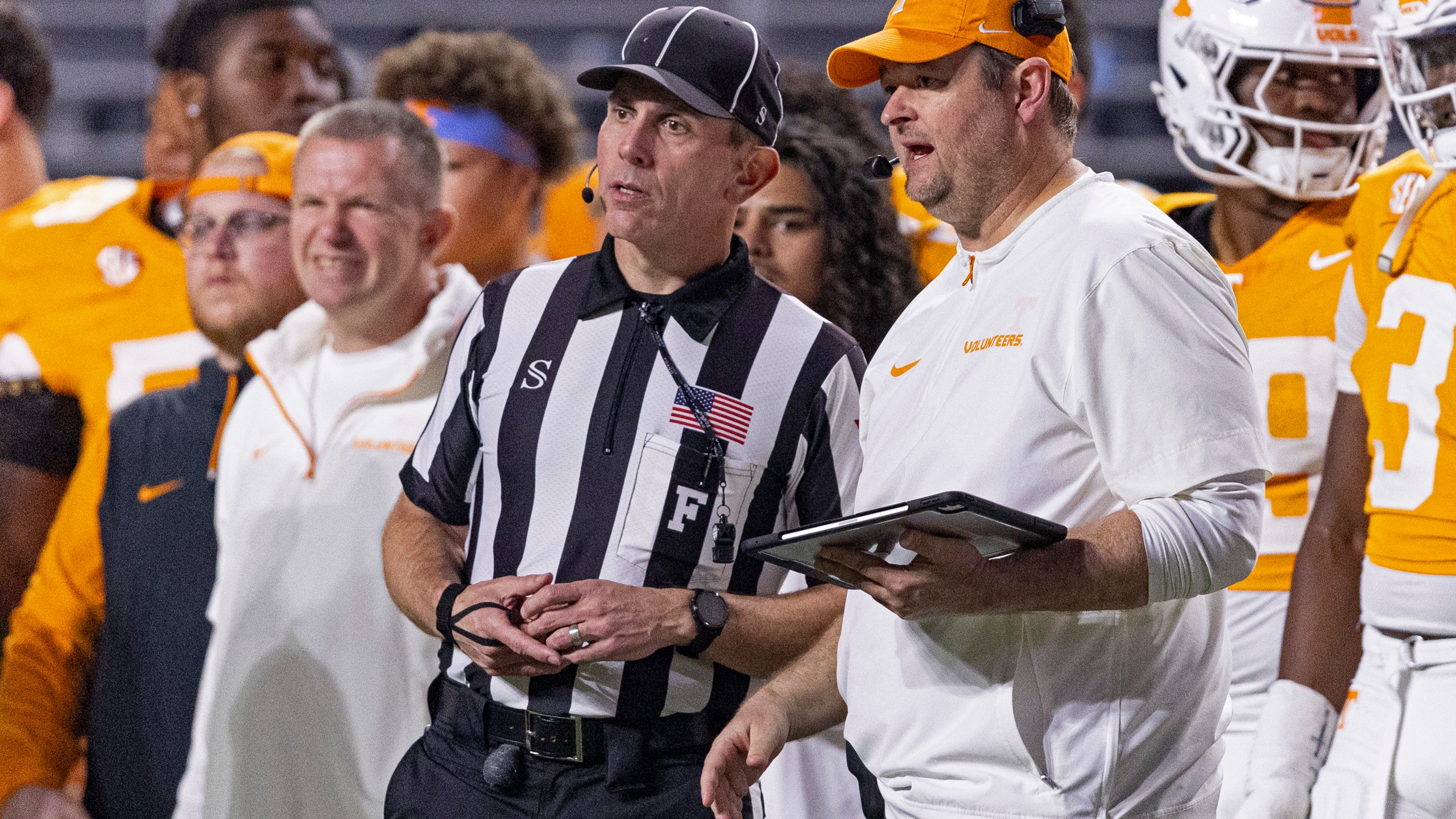 Tennessee head coach Josh Heupel talks with field judge Phillip Davenport during the second half of an NCAA college football game against Mississippi State, Saturday, Nov. 9, 2024, in Knoxville, Tenn. (AP Photo/Wade Payne)