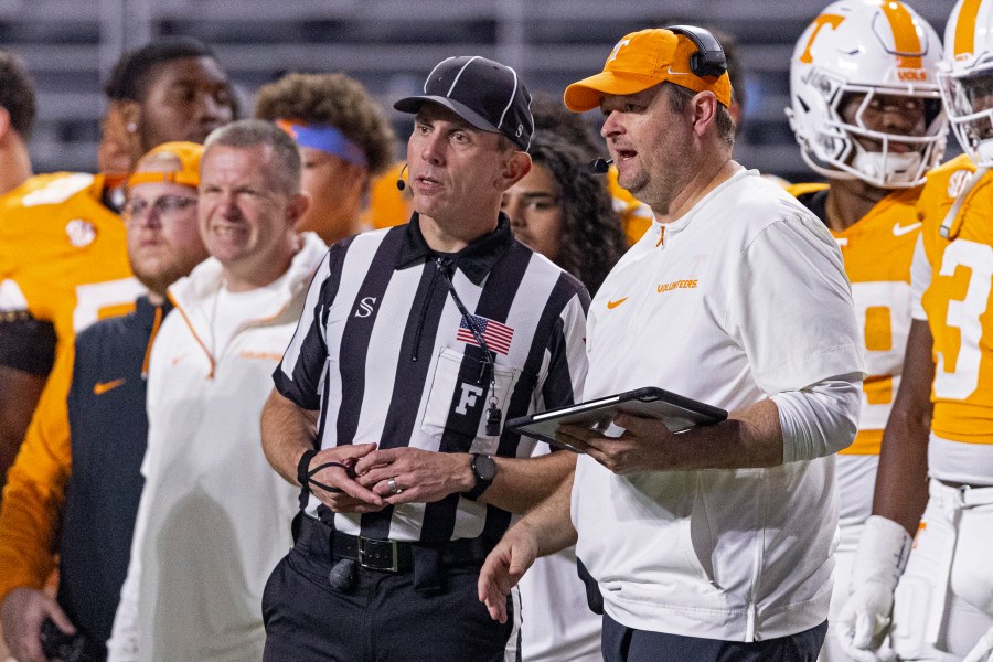 Tennessee head coach Josh Heupel talks with field judge Phillip Davenport during the second half of an NCAA college football game against Mississippi State, Saturday, Nov. 9, 2024, in Knoxville, Tenn. (AP Photo/Wade Payne)