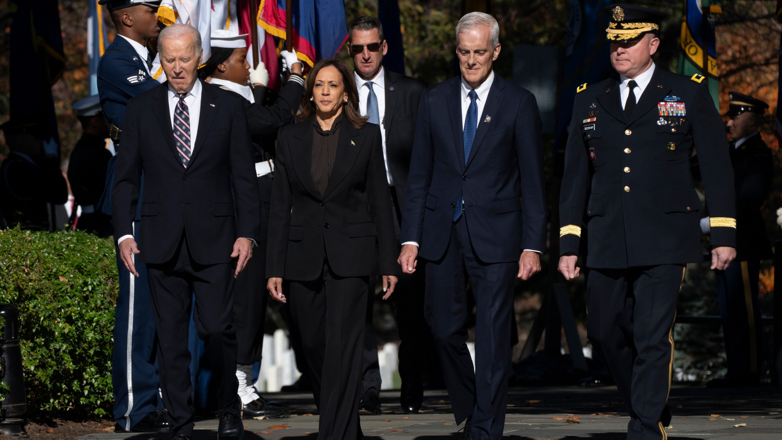 President Joe Biden, from left, Vice President Kamala Harris, Veterans Affairs Secretary Denis McDonough and Maj. Gen. Trevor Bredenkamp, commanding general of the Joint Task Force-National Capital Region and the U.S. Military District of Washington, arrive for a wreath laying ceremony at the Tomb of the Unknown Soldier on National Veterans Day Observance at Arlington National Cemetery in Arlington, Va., Monday, Nov. 11, 2024. (AP Photo/Manuel Balce Ceneta)