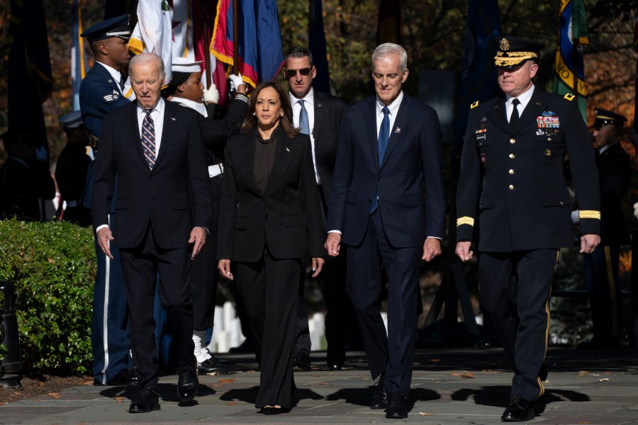 President Joe Biden, from left, Vice President Kamala Harris, Veterans Affairs Secretary Denis McDonough and Maj. Gen. Trevor Bredenkamp, commanding general of the Joint Task Force-National Capital Region and the U.S. Military District of Washington, arrive for a wreath laying ceremony at the Tomb of the Unknown Soldier on National Veterans Day Observance at Arlington National Cemetery in Arlington, Va., Monday, Nov. 11, 2024. (AP Photo/Manuel Balce Ceneta)