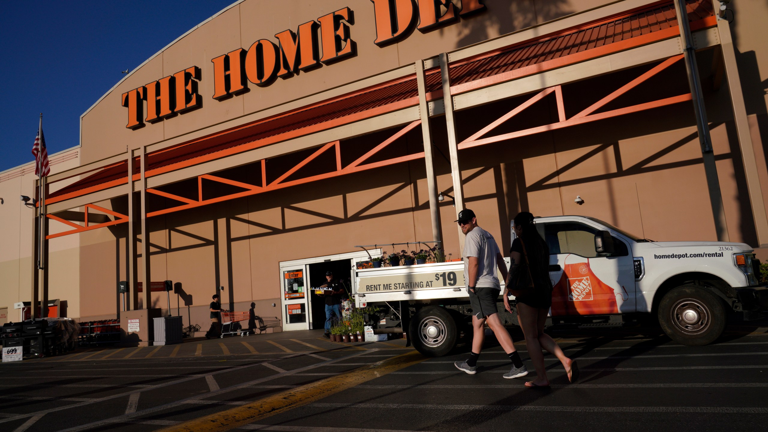 FILE - Customers arrive at The Home Depot store in the Van Nuys section of Los Angeles on July 24, 2023. (AP Photo/Richard Vogel, File)