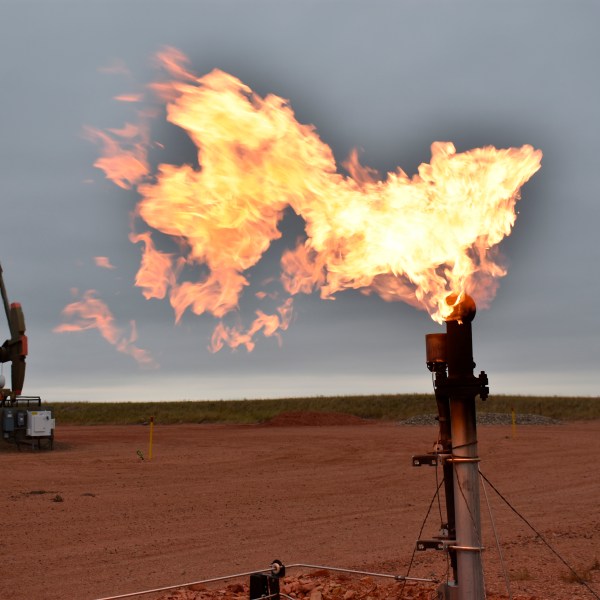 FILE - A flare burns natural gas at an oil well in Watford City, N.D., Aug. 26, 2021. (AP Photo/Matthew Brown, File)