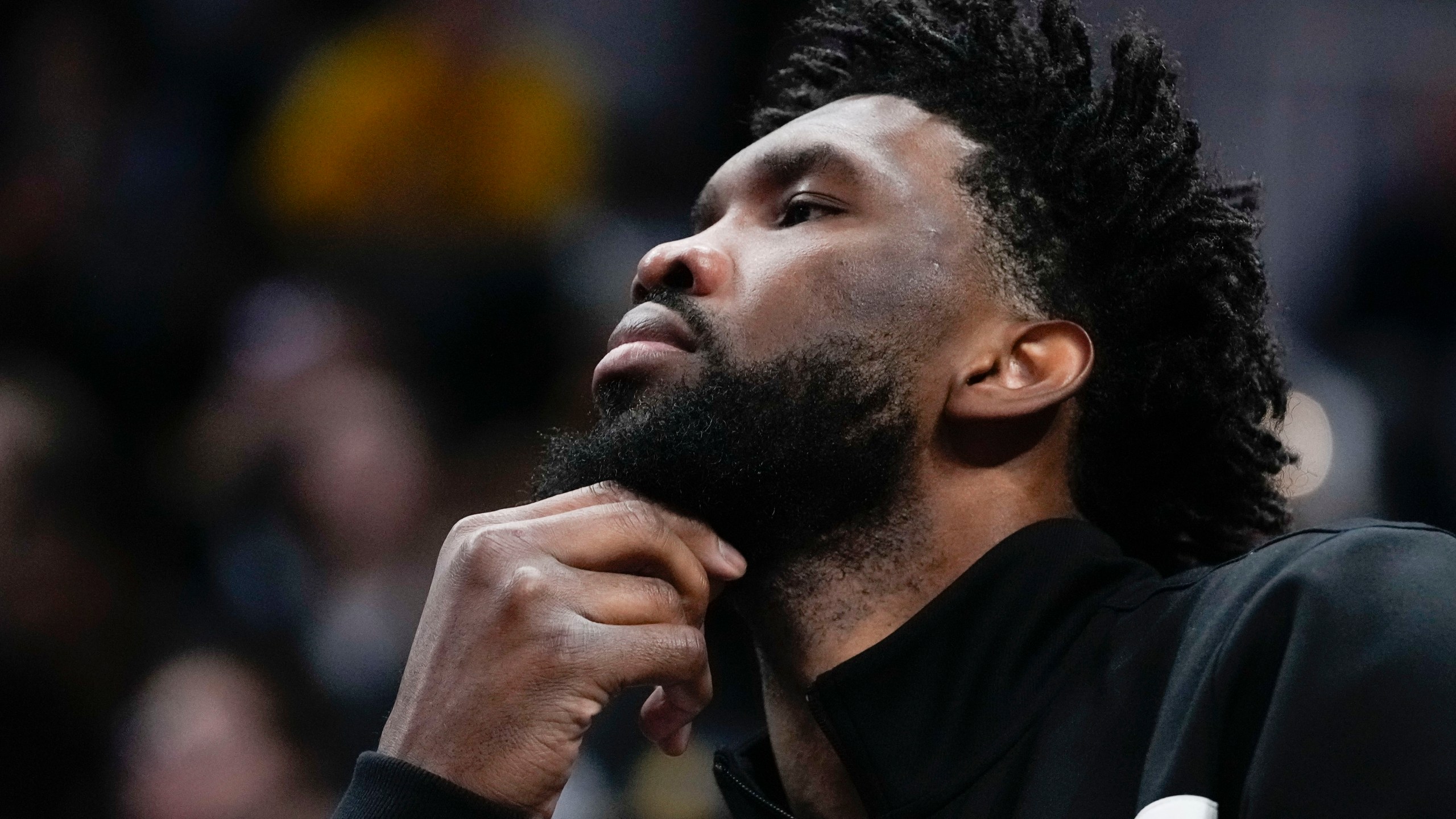 Philadelphia 76ers' Joel Embiid watches from the bench during the second half of an NBA basketball game against the Indiana Pacers, Sunday, Oct. 27, 2024, in Indianapolis. (AP Photo/Darron Cummings)