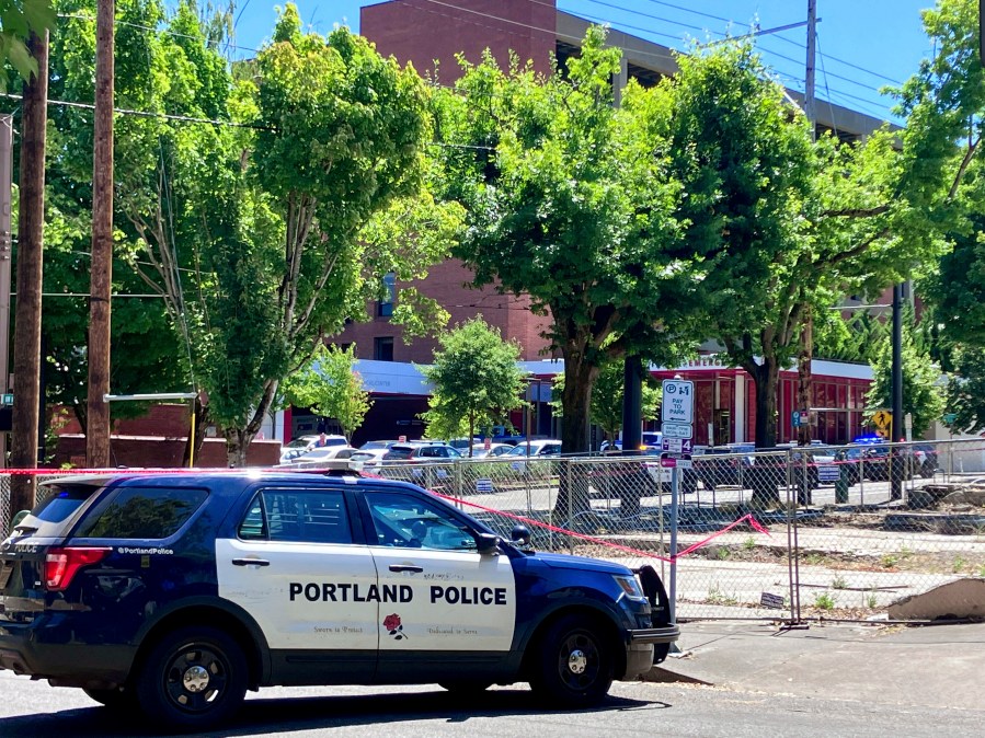 FILE - Portland Police respond to a shooting at the Legacy Good Samaritan Medical Center in Portland, Ore., July 22, 2023. (Maxine Bernstein/The Oregonian via AP, File)