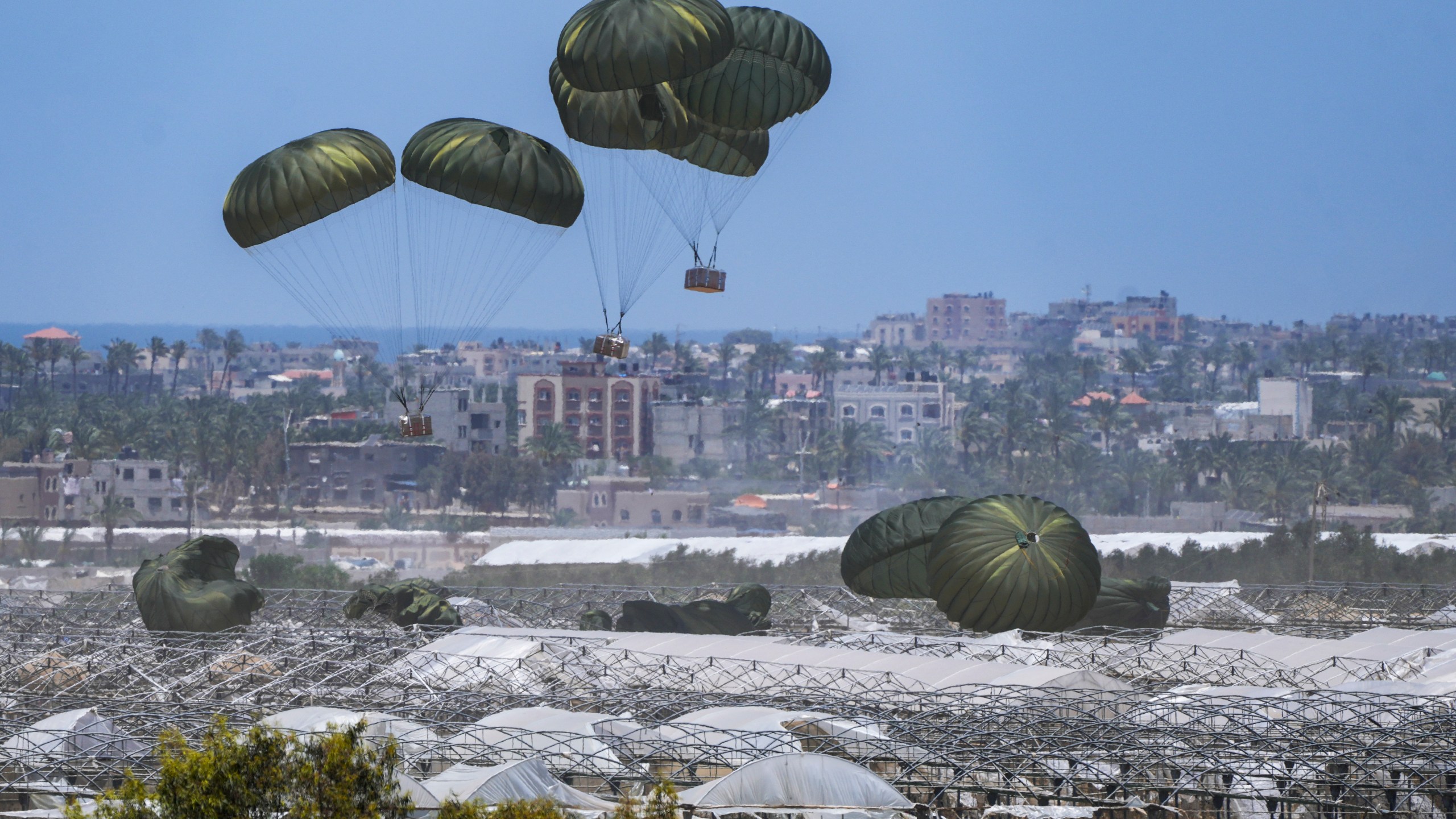 FILE - An aircraft airdrops humanitarian aid over Khan Younis, Gaza Strip, Thursday, May 30, 2024. (AP Photo/Abdel Kareem Hana, File)