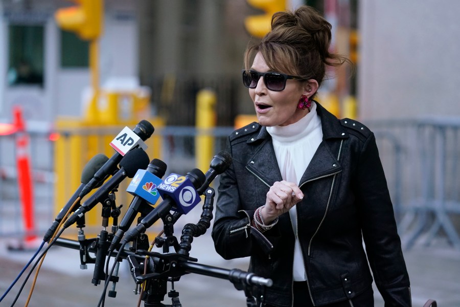 FILE - Former Alaska Gov. Sarah Palin speaks to reporters as she leaves a courthouse in New York, Feb. 14, 2022. (AP Photo/Seth Wenig, File)