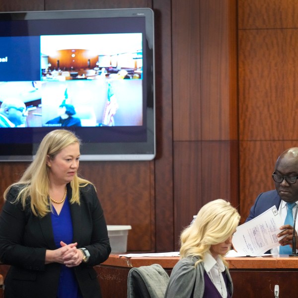 Prosecutor Celeste Byron, left, questions Dr. Kwabena Sarpong, of Texas Children's Hospital, during the punishment phase in Gloria Williams' trial, Tuesday, Nov. 12, 2024, at the Harris County Criminal Justice Center in Houston. (Brett Coomer/Houston Chronicle via AP)