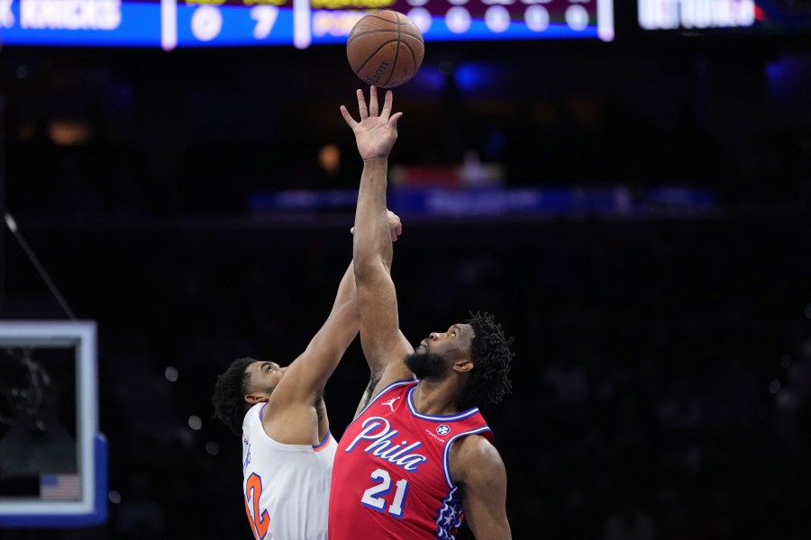 Philadelphia 76ers' Joel Embiid, right, and New York Knicks' Karl-Anthony Towns reach for the tipoff during the first half of an Emirates NBA Cup basketball game, Tuesday, Nov. 12, 2024, in Philadelphia. (AP Photo/Matt Slocum)