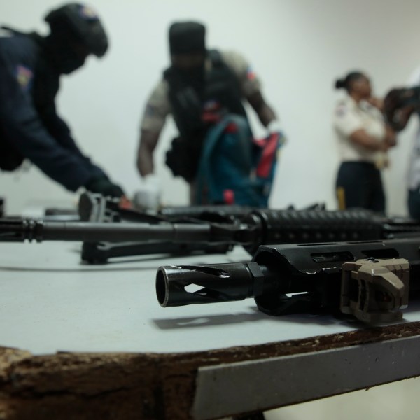 FILE - Police display weapons and equipment seized from gangs during a press conference at police headquarters in Port-au-Prince, Haiti, April 26, 2023. (AP Photo/Odelyn Joseph, File)