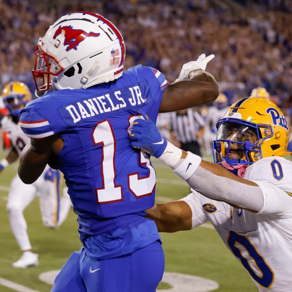 SMU wide receiver Roderick Daniels Jr. (13) is knocked out of bounds by Pittsburgh linebacker Braylan Lovelace (0) during the first half of an NCAA college football game in Dallas, Saturday, Nov. 2, 2024. AP Photo/Gareth Patterson)