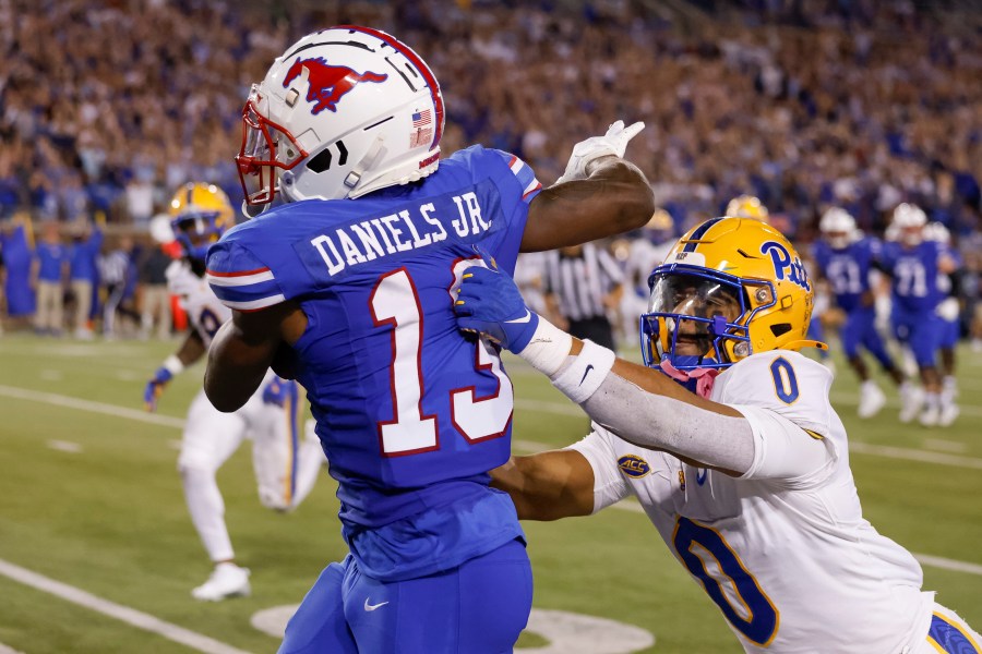 SMU wide receiver Roderick Daniels Jr. (13) is knocked out of bounds by Pittsburgh linebacker Braylan Lovelace (0) during the first half of an NCAA college football game in Dallas, Saturday, Nov. 2, 2024. AP Photo/Gareth Patterson)