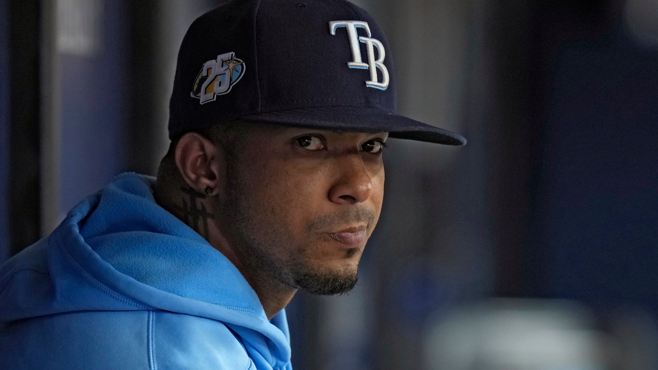 FILE - Tampa Bay Rays shortstop Wander Franco watches from the dugout during the fifth inning of a baseball game against the Cleveland Guardians, Aug. 13, 2023, in St. Petersburg, Fla. (AP Photo/Chris O'Meara, File)