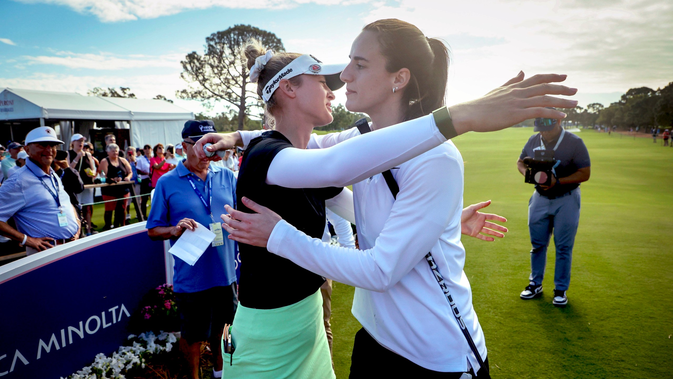 LPGA pro golfer Nelly Korda, left, embraces WNBA basketball player Caitlin Clark, of the Indiana Fever, at the 10th tee during the pro-am at the LPGA Tour golf tournament, Wednesday, Nov 13, 2024, at the Pelican Golf Club in Belleair, Fla. (Douglas R. Clifford/Tampa Bay Times via AP)