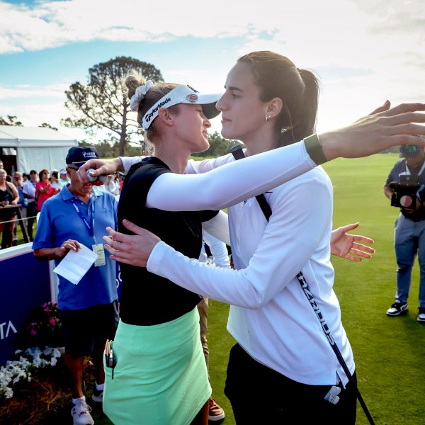 LPGA pro golfer Nelly Korda, left, embraces WNBA basketball player Caitlin Clark, of the Indiana Fever, at the 10th tee during the pro-am at the LPGA Tour golf tournament, Wednesday, Nov 13, 2024, at the Pelican Golf Club in Belleair, Fla. (Douglas R. Clifford/Tampa Bay Times via AP)