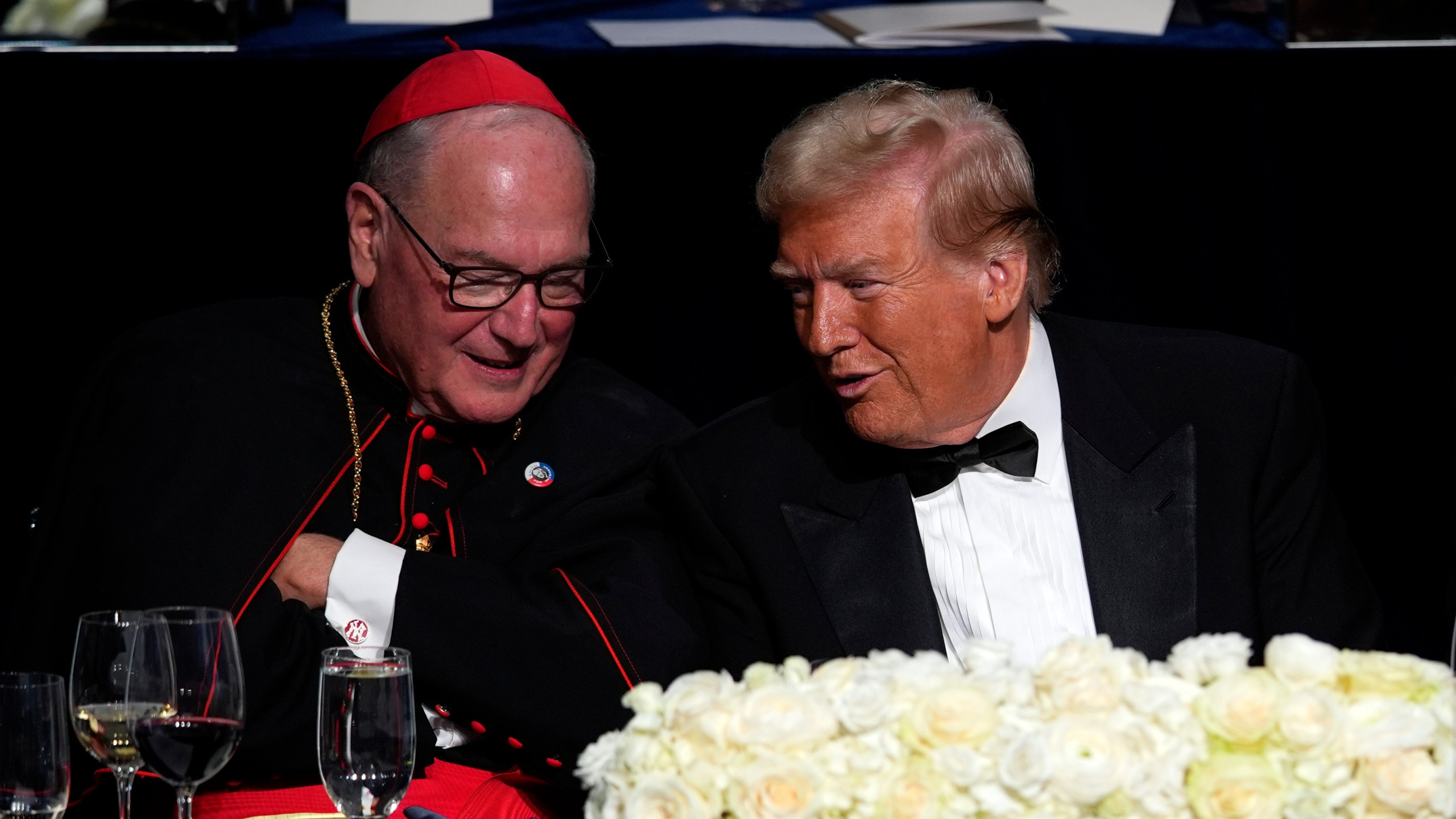 Republican presidential nominee former President Donald Trump talks with Cardinal Timothy Dolan at the 79th annual Alfred E. Smith Memorial Foundation Dinner, Thursday, Oct. 17, 2024, in New York. (AP Photo/Julia Demaree Nikhinson)