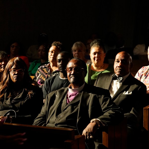 FILE - Palm Springs Section 14 neighborhood residents and descendants listen to Areva Martin, civil rights attorney, at the United Methodist Church in Palm Springs, Calif., Sunday, April 16, 2023. (AP Photo/Damian Dovarganes, File)