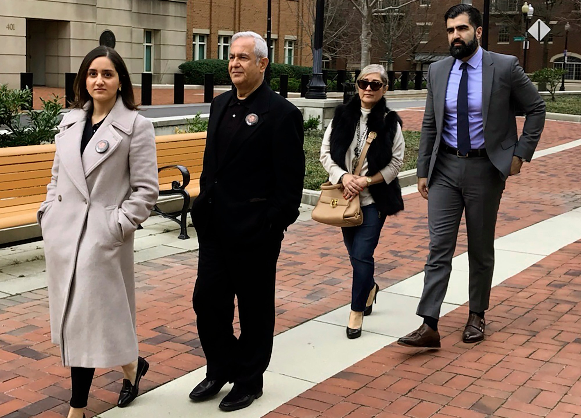 FILE - The family of Bijan Ghaisar, from left, Negeen Ghaisar, James Ghaisar, Kelly Ghaisar and Kouros Emami walk outside federal court in Alexandria, Va., March 6, 2020. (AP Photo/Matthew Barakat, File)