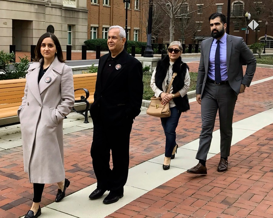 FILE - The family of Bijan Ghaisar, from left, Negeen Ghaisar, James Ghaisar, Kelly Ghaisar and Kouros Emami walk outside federal court in Alexandria, Va., March 6, 2020. (AP Photo/Matthew Barakat, File)