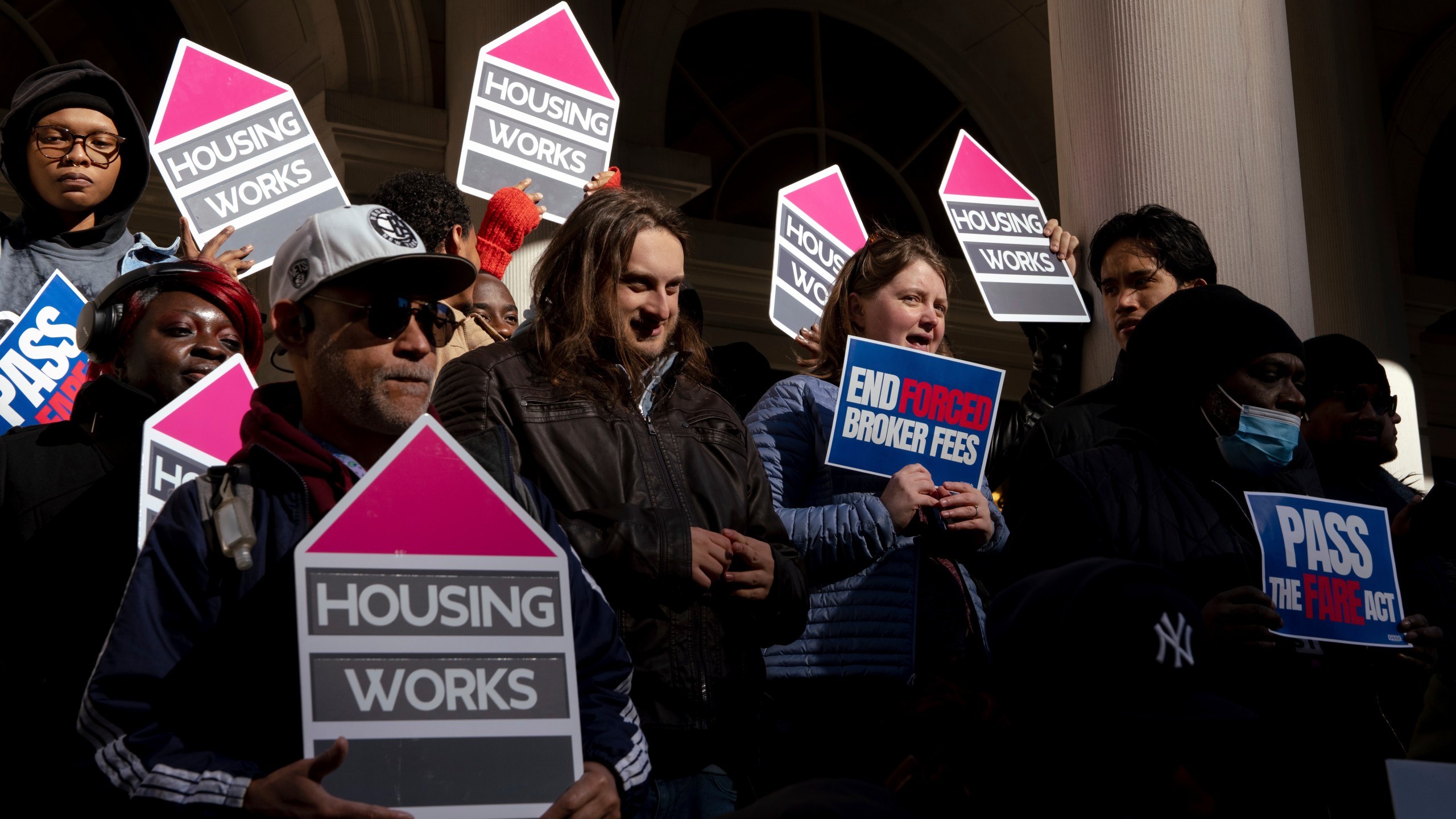 People gather outside of City Hall for a rally in support of the FARE Act ahead of a City Council meeting, Wednesday, Nov. 13, 2024, in New York. (AP Photo/Adam Gray)