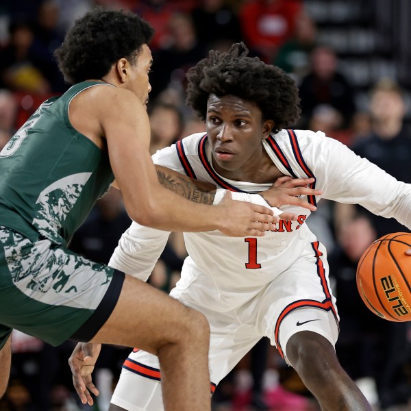 St. John's guard Kadary Richmond (1) looks to drive around Wagner guard Ja'Kair Sanchez during the second half of an NCAA college basketball game Wednesday, Nov. 13, 2024, in New York. St. John's won 66-45. (AP Photo/Adam Hunger)