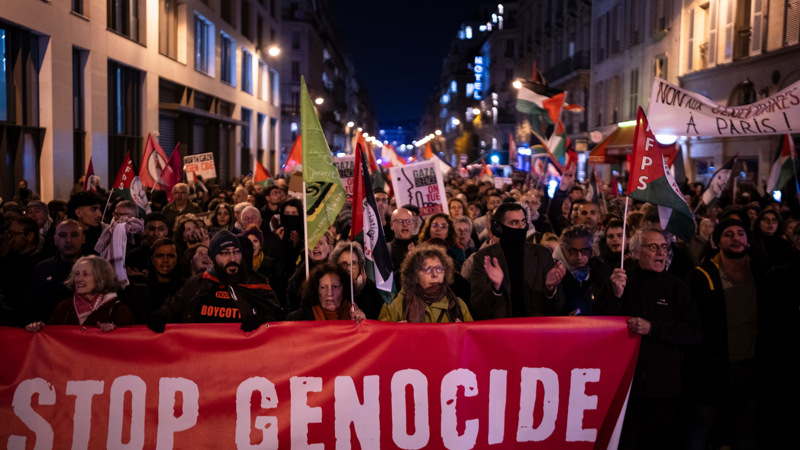 Protesters take part in a rally against the "Israel is Forever" gala organized by far-right Franco-Israeli figures, in Paris, Wednesday, Nov. 13, 2024, on the eve of the UEFA Nations League 2025 soccer match between France and Israel. (AP Photo/Louise Delmotte)