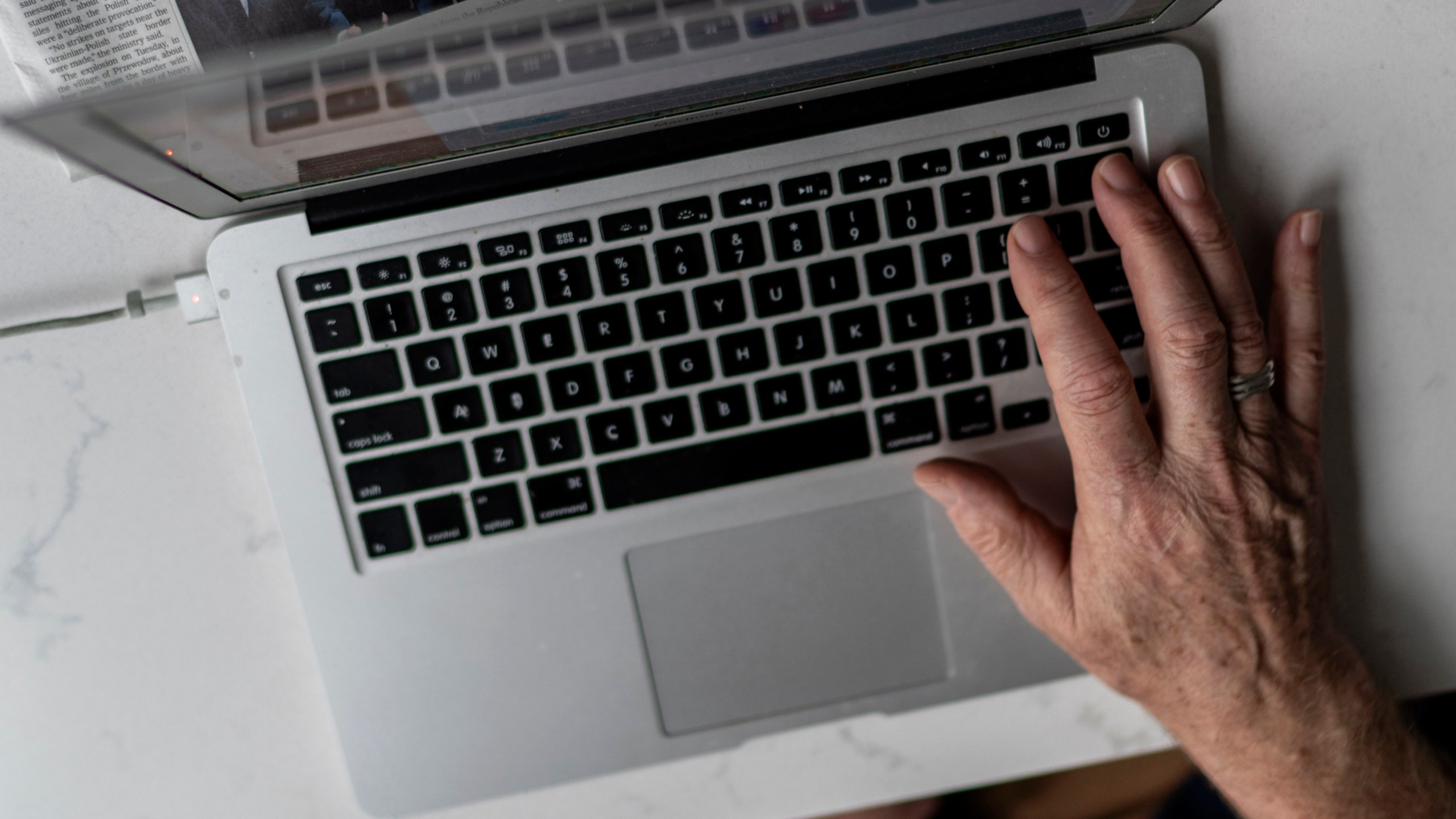 FILE - A person works on a laptop computer in Hudson, Wis., Nov. 16, 2022. (AP Photo/David Goldman, File)