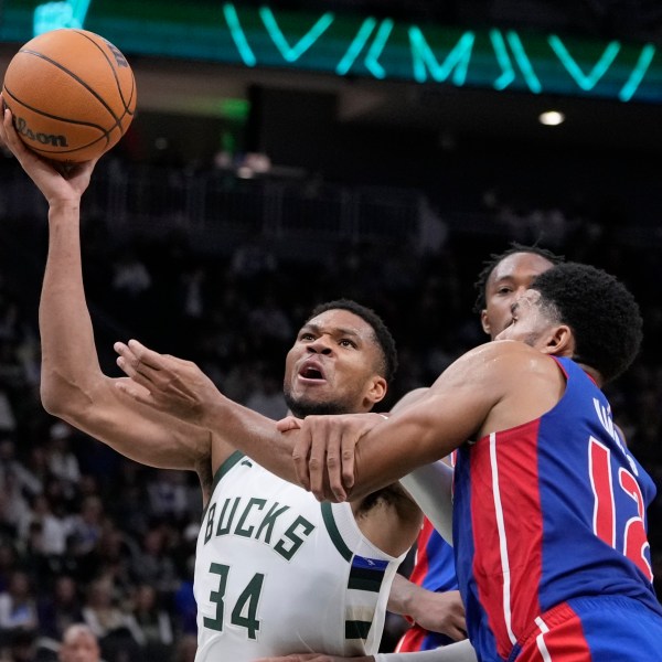 Detroit Pistons' Tobias Harris fouls Milwaukee Bucks' Giannis Antetokounmpo during the second half of an NBA basketball game Wednesday, Nov. 13, 2024, in Milwaukee. (AP Photo/Morry Gash)