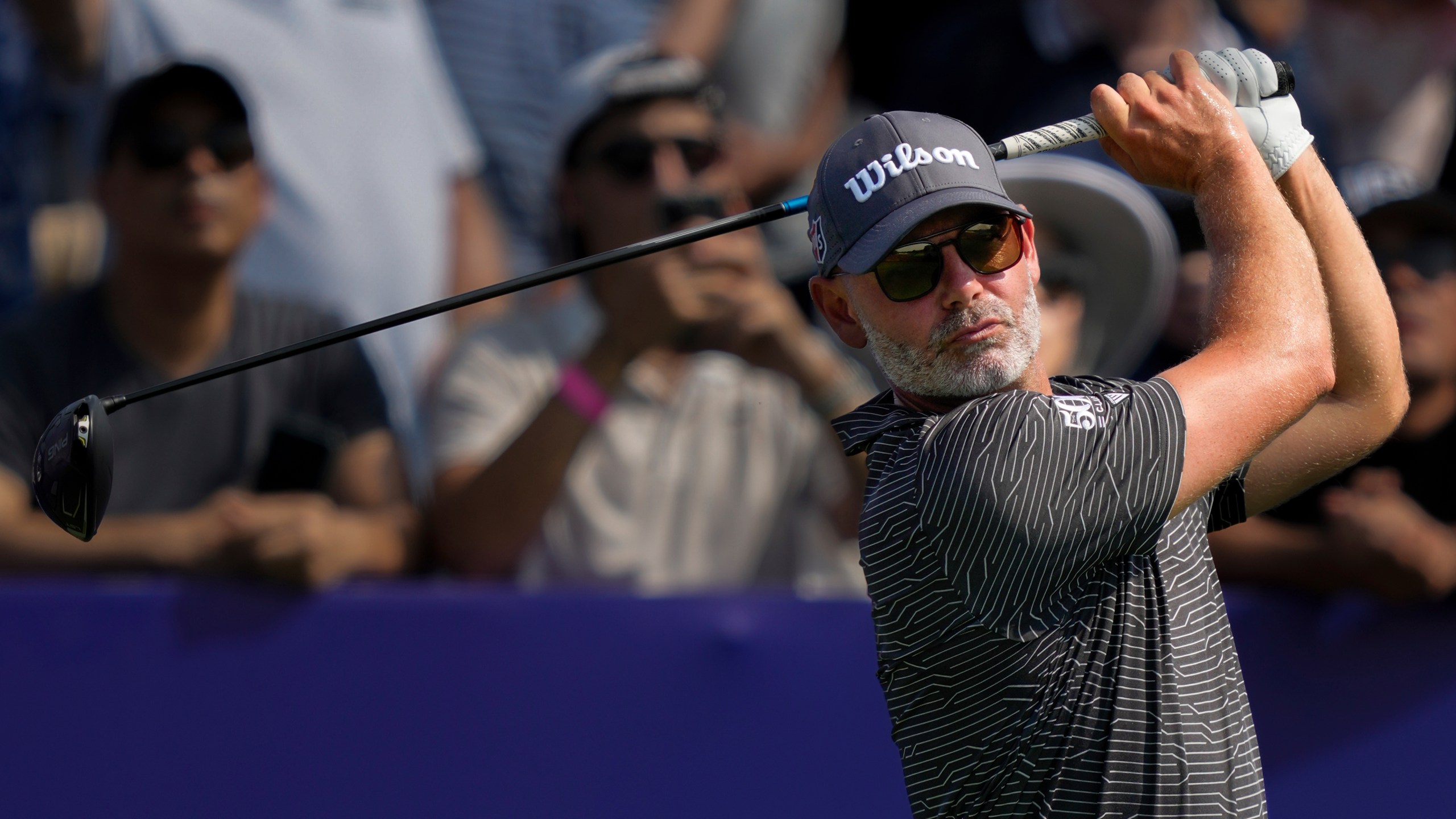 Paul Waring of England hits off the first tee during the first round of World Tour Golf Championship in Dubai, United Arab Emirates, Thursday, Nov. 14, 2024. (AP Photo/Altaf Qadri)