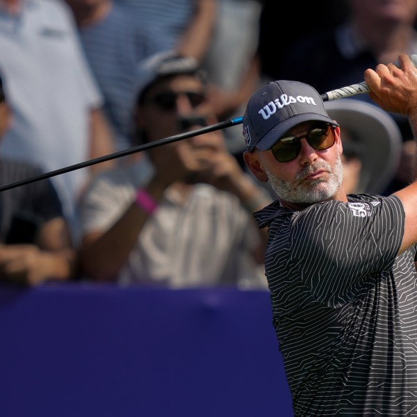 Paul Waring of England hits off the first tee during the first round of World Tour Golf Championship in Dubai, United Arab Emirates, Thursday, Nov. 14, 2024. (AP Photo/Altaf Qadri)