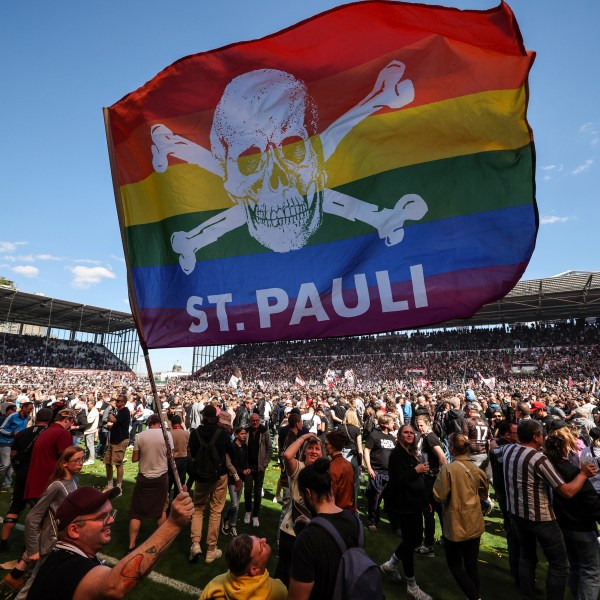 FILE - St. Pauli's fans invade the field after their team won 3-1 during a second division, Bundesliga soccer match at the Millerntor Stadium, in Hamburg, Germany, May 12, 2024. (Christian Charisius/dpa via AP File)