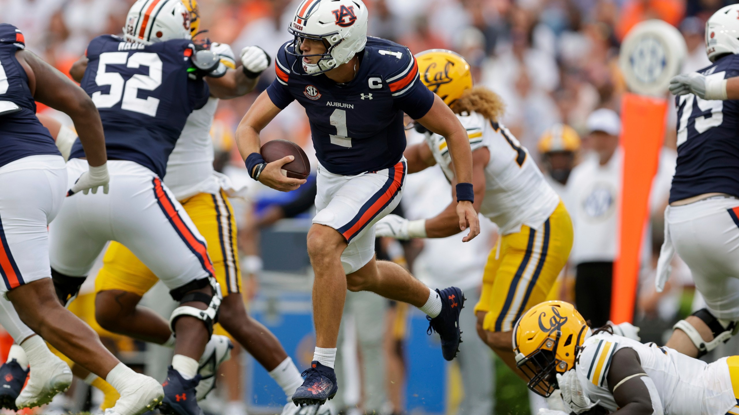 FILE - Auburn's Payton Thorne (1) runs the ball during the second half of an NCAA football game against California, Sept. 7, 2024 in Auburn, Ala. (AP Photo/Stew Milne, File)