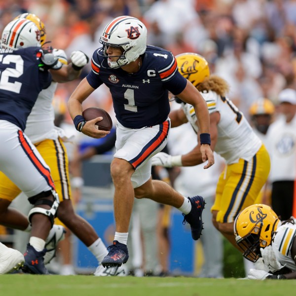 FILE - Auburn's Payton Thorne (1) runs the ball during the second half of an NCAA football game against California, Sept. 7, 2024 in Auburn, Ala. (AP Photo/Stew Milne, File)