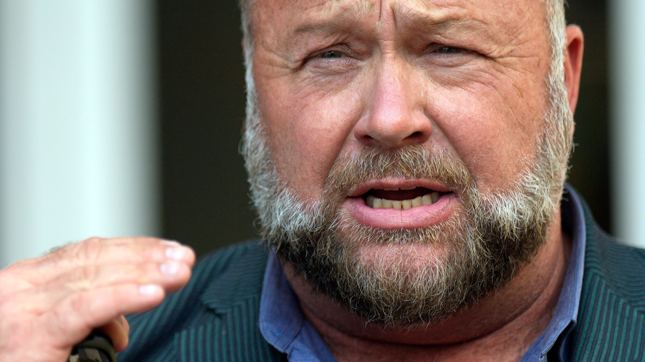 FILE - Right-wing conspiracy theorist Alex Jones speaks outside the federal courthouse after a bankruptcy hearing Friday, June 14, 2024, in Houston. (AP Photo/David J. Phillip, File)