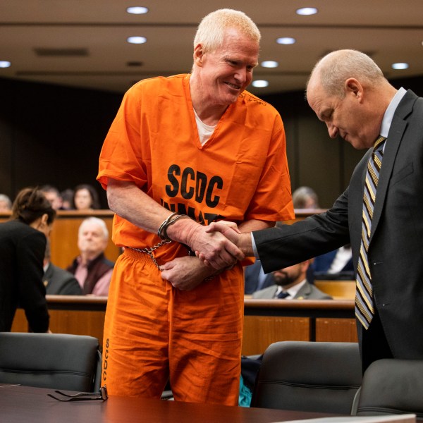 FILE- Alex Murdaugh, convicted of killing his wife, Maggie, and younger son, Paul, in June 2021, greets his defense attorney Jim Griffin before a hearing on the motion for a retrial, Tuesday, Jan. 16, 2024, at the Richland County Judicial Center, in Columbia, S.C. (Gavin McIntyre/The Post and Courier via AP, Pool, File)