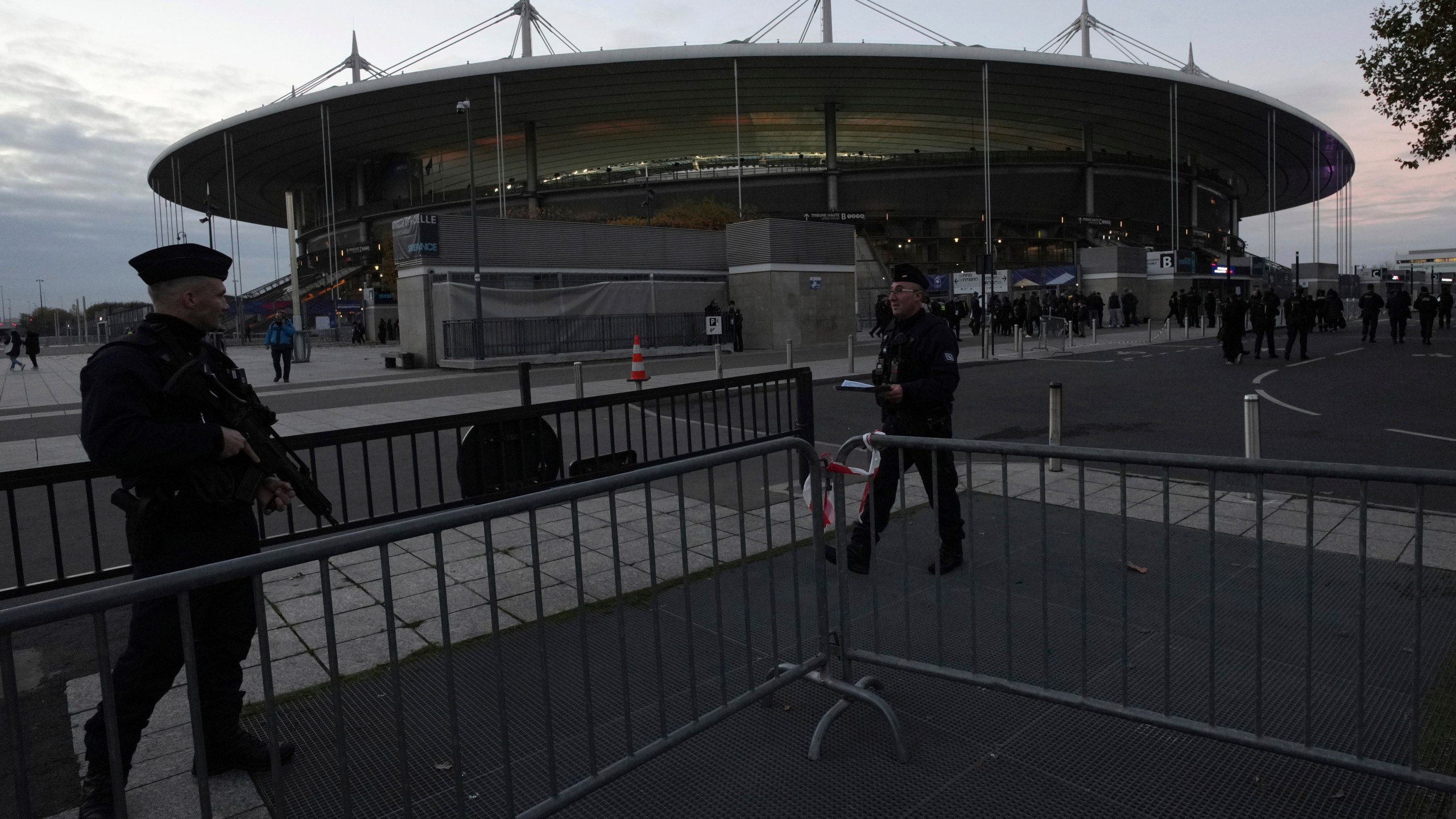 Police officers patrol in front of the stadium ahead of the Nations League soccer match France against Israel outside the Stade de France stadium, Thursday, Nov. 14, 2024 in Saint-Denis, outside Paris. (AP Photo/Aurelien Morissard)