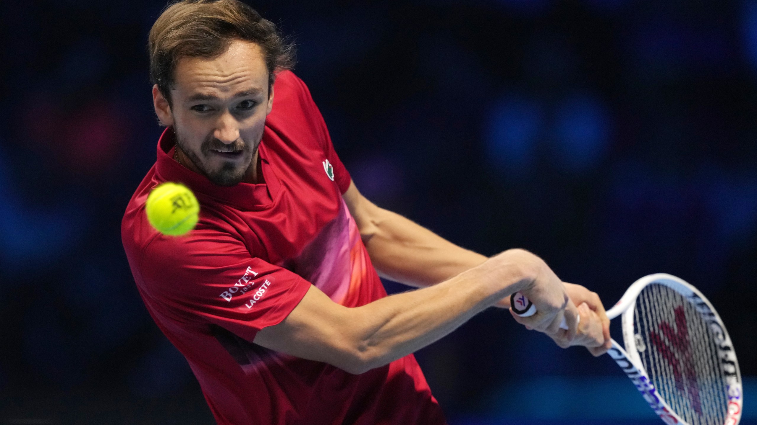 Russia's Daniil Medvedev returns the ball to Italy's Jannik Sinner during their singles tennis match of the ATP World Tour Finals at the Inalpi Arena, in Turin, Italy, Thursday, Nov. 14, 2024. (AP Photo/Antonio Calanni)