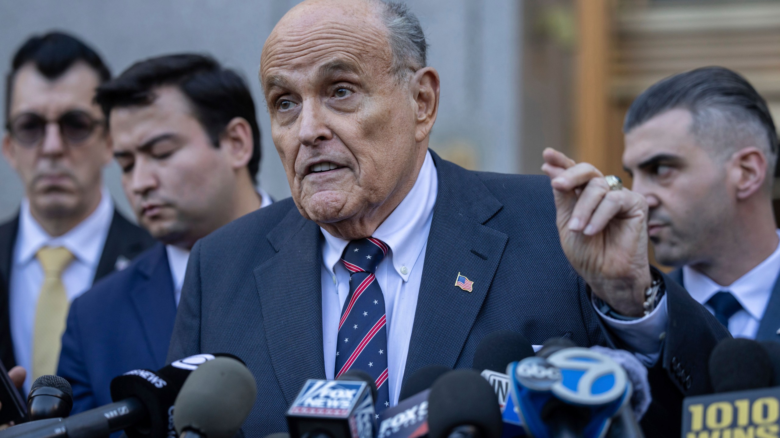 Former New York City Mayor Rudy Giuliani speaks to the members of the media as he leaves court in New York, Thursday, Nov. 7, 2024. (AP Photo/Yuki Iwamura)