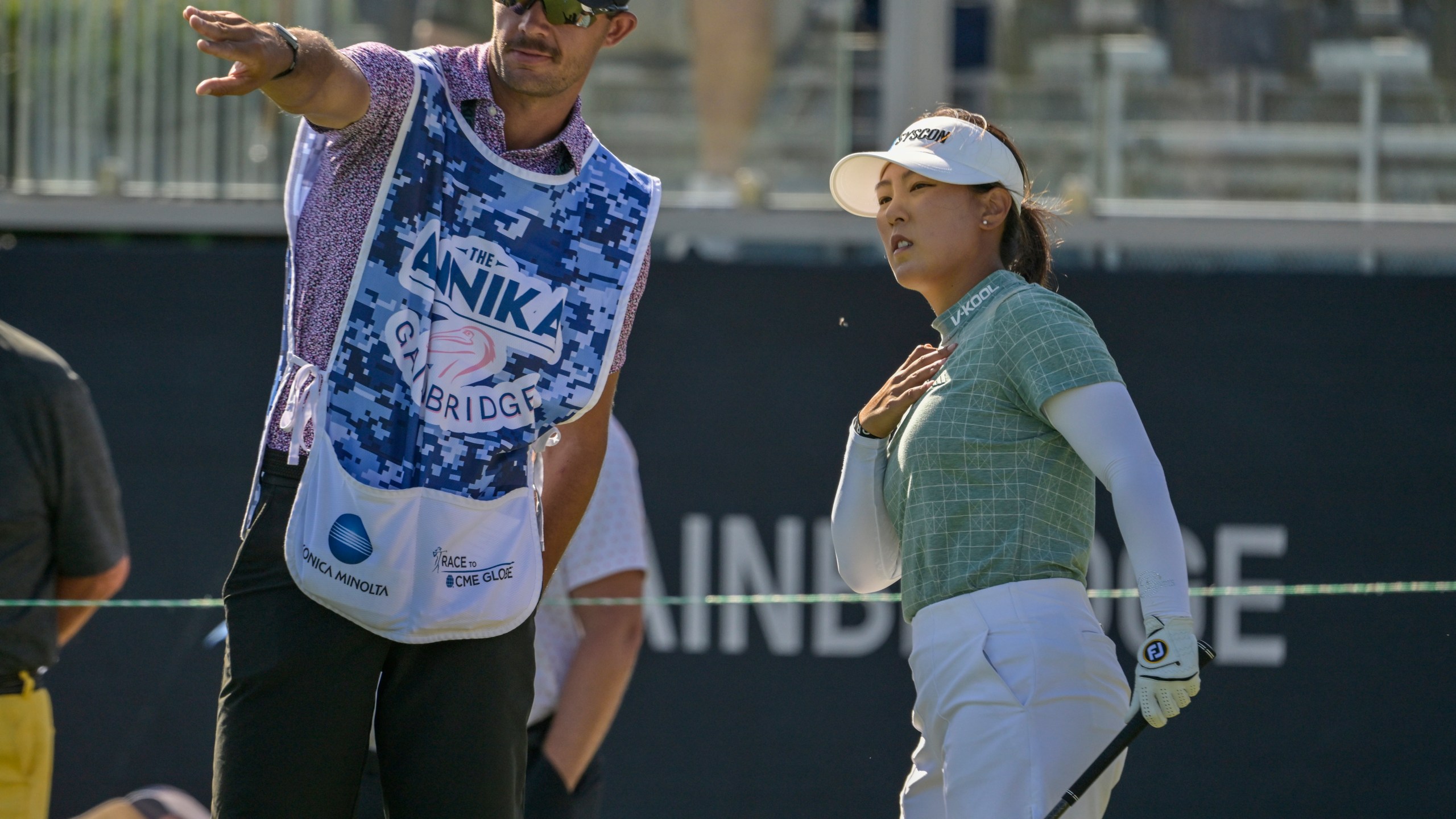 Jiwon Jeon, right, of South Korea, talks with her caddy on the first tee during the first round of The Annika golf tournament at Pelican Golf Club, Thursday, Nov. 14, 2024, in Belleair, Fla. (AP Photo/Steve Nesius)